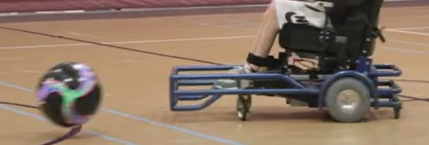 Power soccer chair going after a ball